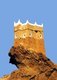 Al-Ghowaizi Fort, Tower or Castle (Husn Al-Alghwayzi حصن الغويزي) is located on the western outskirts of Al Mukalla (Arabic: المكلا‎ Al Mukallā), the main sea port and the capital city of the Hadramaut coastal region of Yemen in the southern part of Arabia on the Gulf of Aden close to the Arabian Sea.<br/><br/>

It is located 480 km (300 mi) east of Aden and is the most important port in the Governorate of Hadramaut, the largest governorate in South Arabia. Al Mukalla is the fourth largest city in Yemen with a population of approximately 300,000. The city is served by the nearby Riyan Airport.